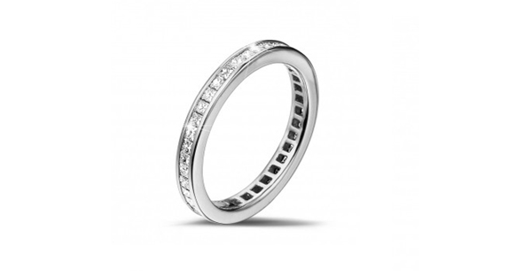 a beautiful eternity ring featuring a platinum band and a full-diamond setting
