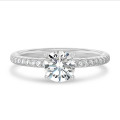 1.00 carat solitaire ring in white gold with side diamonds