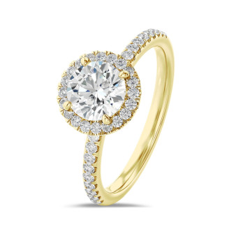 1.50 carat solitaire halo ring in yellow gold with round diamonds