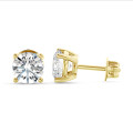 2.00 carat solitaire earrings with round diamonds in yellow gold