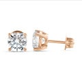 2.00 carat solitaire earrings with round diamonds in red gold