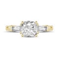 2.00 carat trilogy ring in yellow gold with a cushion diamond and tapered baguettes