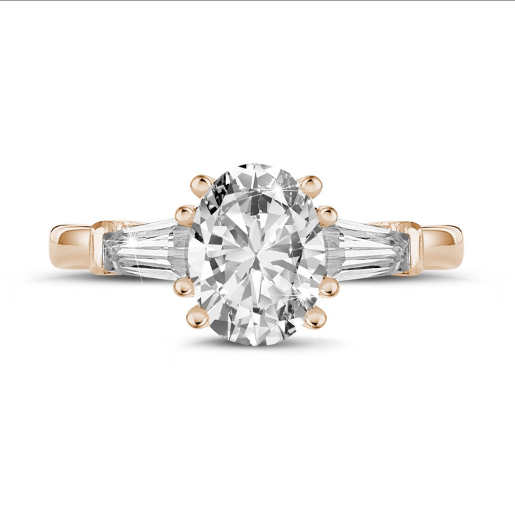 2.00 carat trilogy ring in red gold with oval diamond and tapered baguettes
