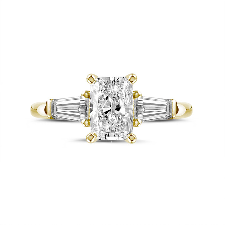2.00 carat trilogy ring in yellow gold with a radiant cut diamond and tapered baguettes