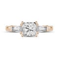 1.50 carat trilogy ring in red gold with a princess diamond and tapered baguettes