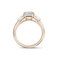 1.50 carat trilogy ring in red gold with a princess diamond and tapered baguettes