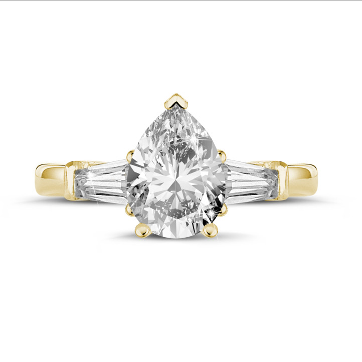 1.50 carat trilogy ring in yellow gold with pear diamond and tapered baguettes