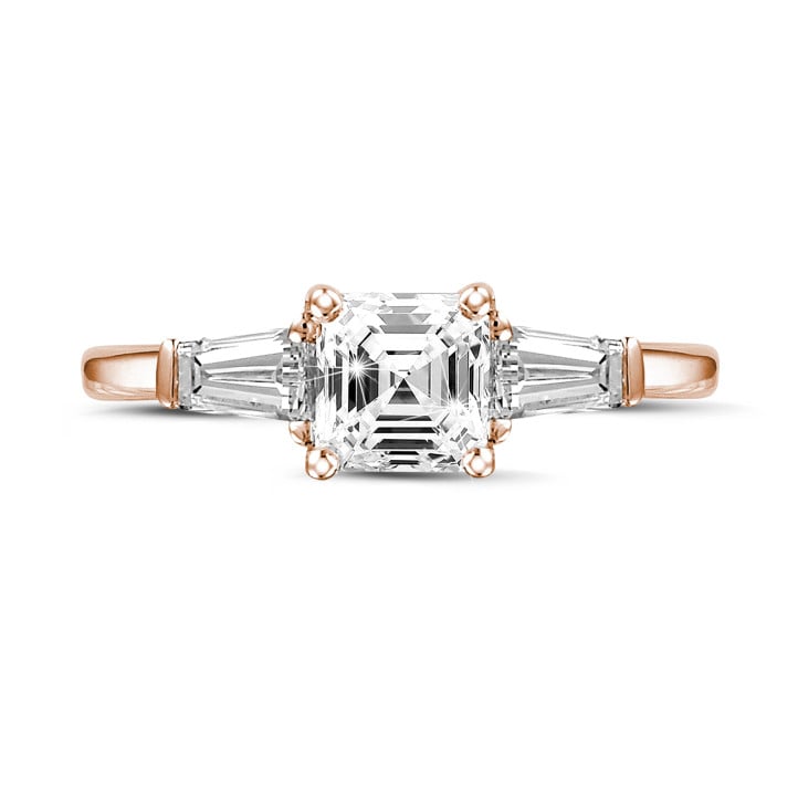 1.50 carat trilogy ring in red gold with an asscher cut diamond and tapered baguettes