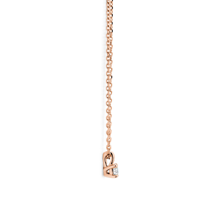 0.15 carat solitaire pendant with a round cut diamond in red gold