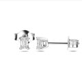 0.30 carat solitaire earrings with emerald cut diamonds in white gold