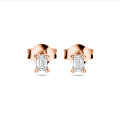 0.30 carat solitaire earrings with emerald cut diamonds in red gold