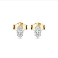 0.30 carat solitaire earrings with Marquise cut diamonds in yellow gold