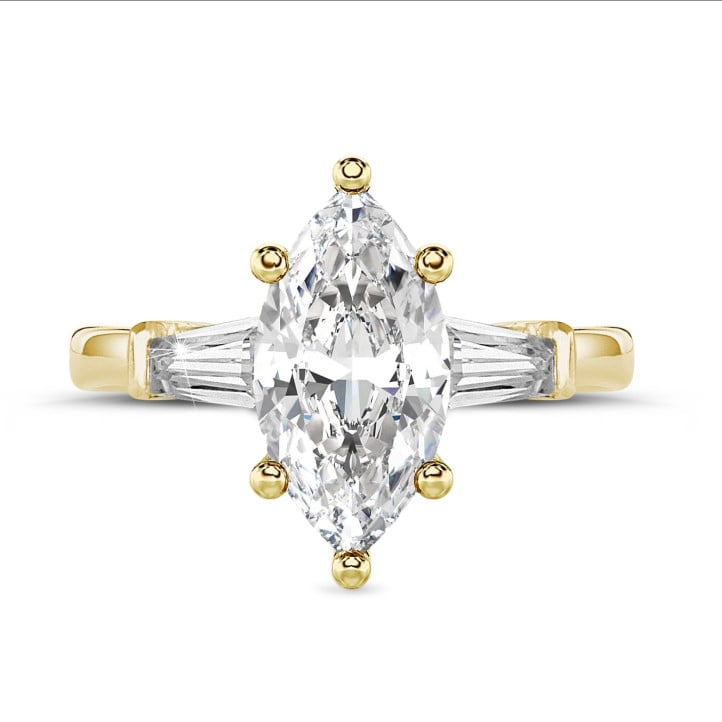 2.00 carat trilogy ring in yellow gold with marquise diamond and tapered baguettes