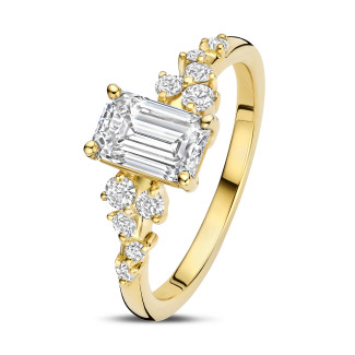 Engagement - 0.70 carat solitaire cluster ring in yellow gold with an emerald cut diamond
