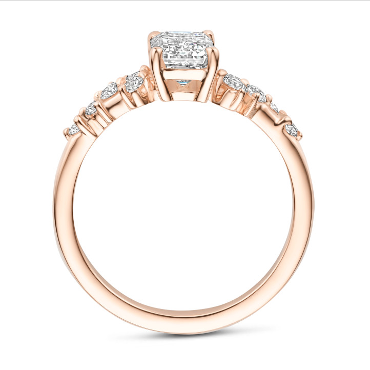 0.70 carat solitaire cluster ring in red gold with an emerald cut diamond
