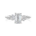 1.50 carat solitaire cluster ring in white gold with an emerald cut diamond
