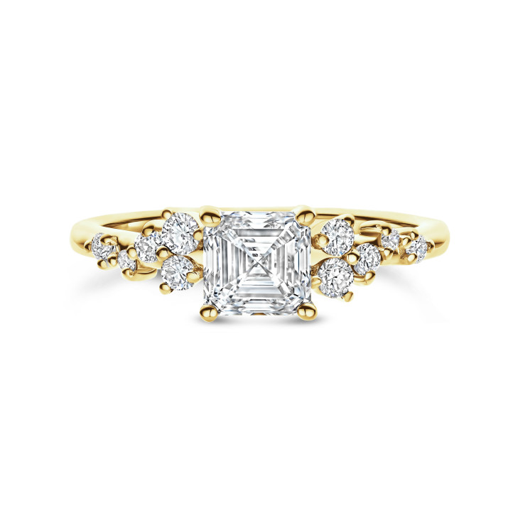0.70 carat solitaire cluster ring in yellow gold with an asscher cut diamond
