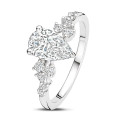 0.70 carat solitaire cluster ring in white gold with a pear cut diamond
