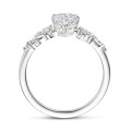 0.70 carat solitaire cluster ring in white gold with a pear cut diamond