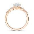 1.20 carat solitaire cluster ring in red gold with a pear cut diamond