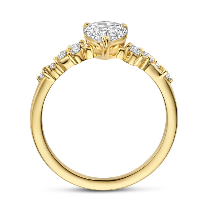1.50 carat solitaire cluster ring in yellow gold with a pear cut diamond