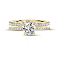 0.70 carat solitaire ring in yellow gold with side diamonds