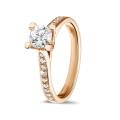 0.50 carat solitaire diamond ring in red gold with side diamonds