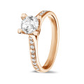 0.70 carat solitaire diamond ring in red gold with side diamonds
