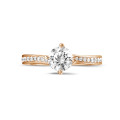 0.70 carat solitaire diamond ring in red gold with side diamonds