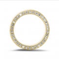 0.70 carat eternity ring in yellow gold with small round diamonds on the side