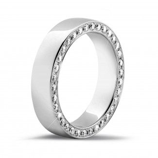 0.70 carat eternity ring in platinum with small round diamonds on the side