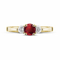 Trilogy ring in yellow gold with a central ruby and 2 round diamonds