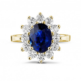 Rings - Entourage ring in yellow gold with an oval sapphire and round diamonds