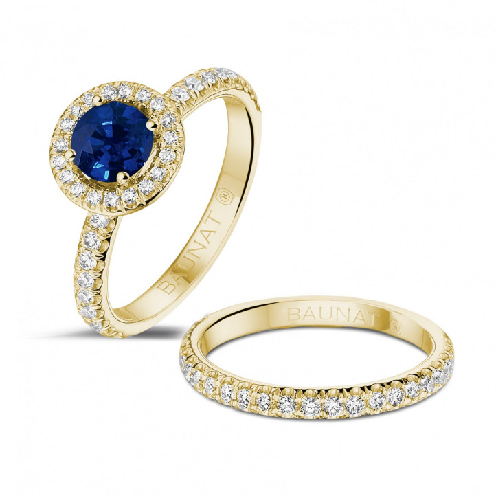 Halo solitaire ring in yellow gold with a round sapphire and small diamonds