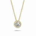 0.50 carat diamond halo necklace in yellow gold