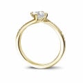 0.50 carat solitaire ring in yellow gold with princess diamond and side diamonds