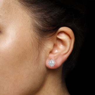 1.75 carat entourage earrings in platinum with oval and round diamonds