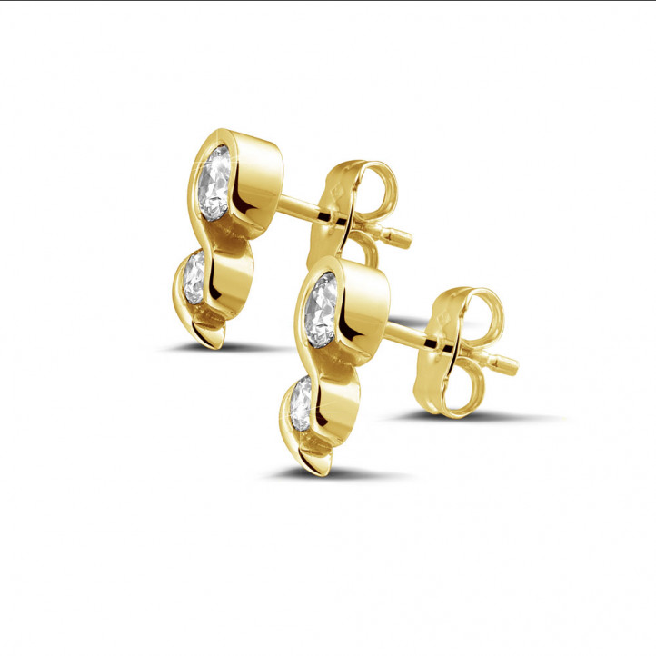 0.70 carat diamond earrings in yellow gold