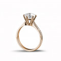 2.00 carat solitaire diamond ring in red gold with side diamonds