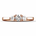 0.45 carat trilogy ring in red gold with round diamonds