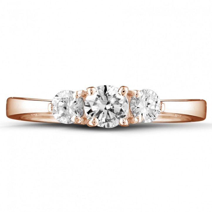 0.67 carat trilogy ring in red gold with round diamonds
