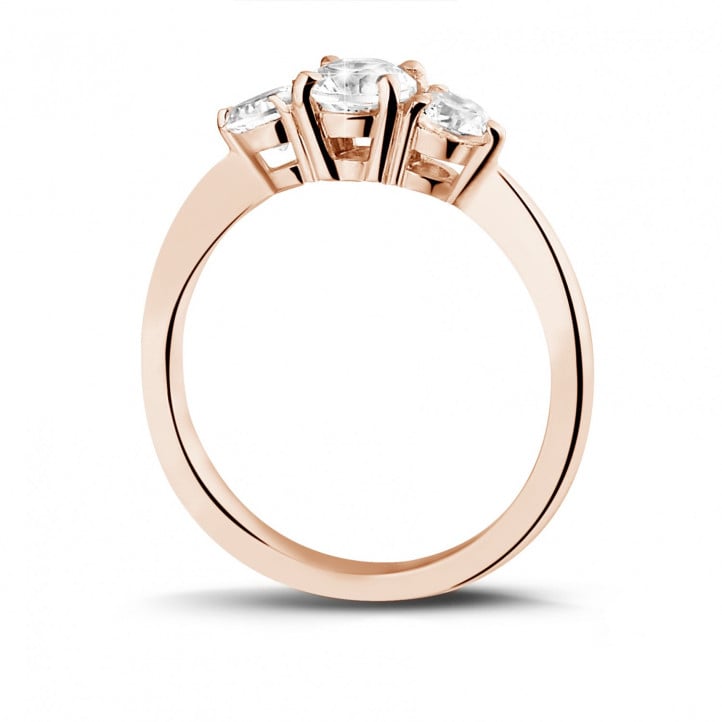 0.95 carat trilogy ring in red gold with round diamonds