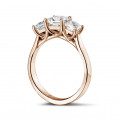 1.50 carat trilogy ring in red gold with princess diamonds