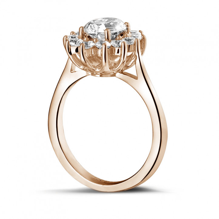 1.85 carat entourage ring in red gold with oval diamond