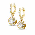1.55 carat diamond halo earrings in yellow gold