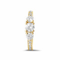1.10 carat trilogy ring in yellow gold with side diamonds