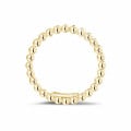 Stackable beaded ring in yellow gold