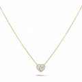 0.65 carat heart-shaped necklace in yellow gold with round diamonds