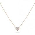 0.65 carat heart-shaped necklace in red gold with round diamonds