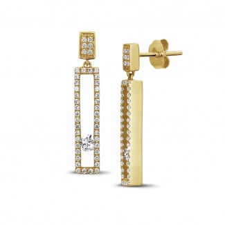 0.55 carat earrings in yellow gold with floating round diamonds